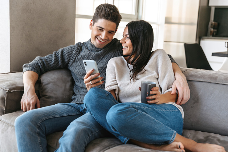 Couple sat on a sofa